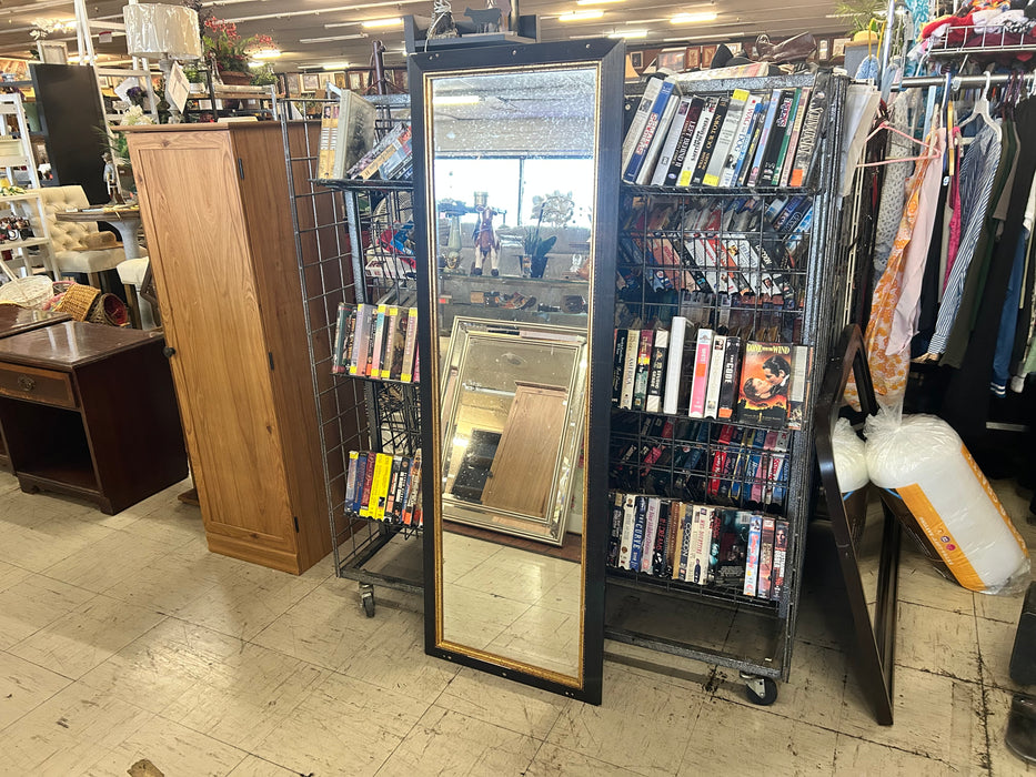 Wall mirror with black and gold trim 34095