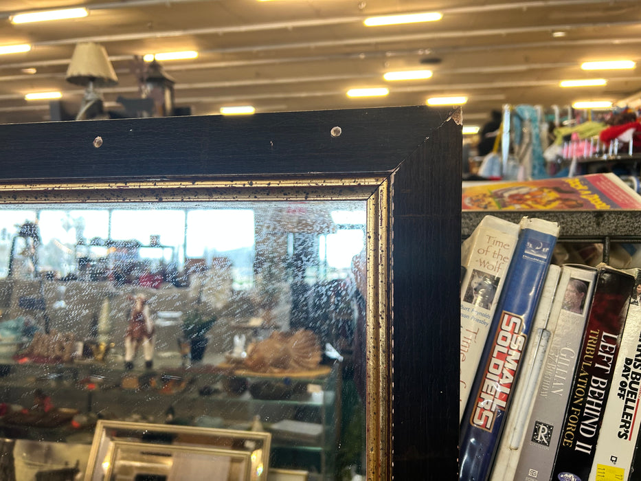 Wall mirror with black and gold trim 34095