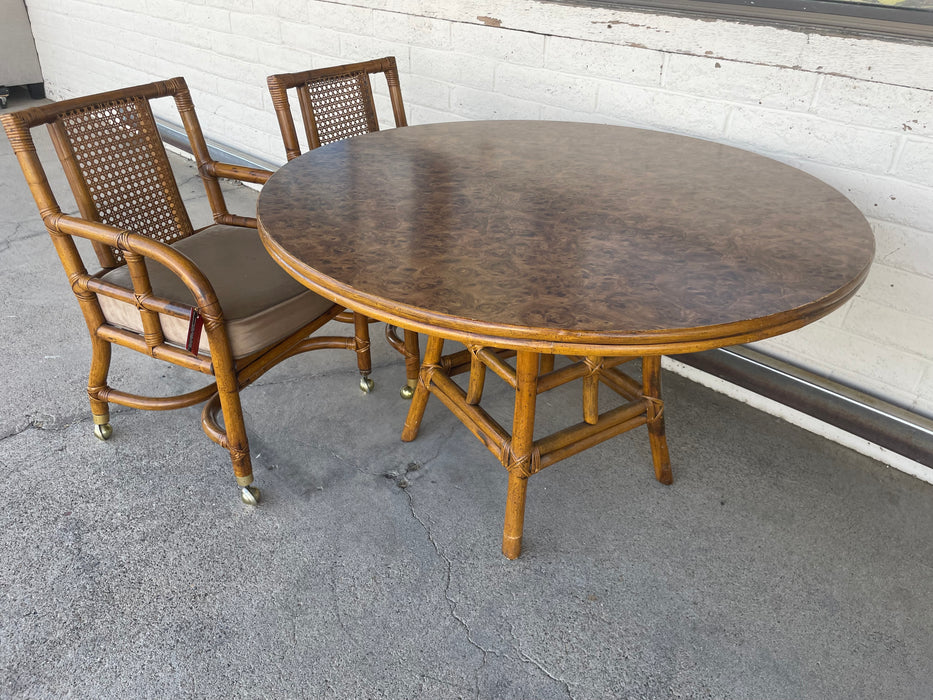 Burlwood dining table w/ 2 rattan/cane chairs on casters 30923