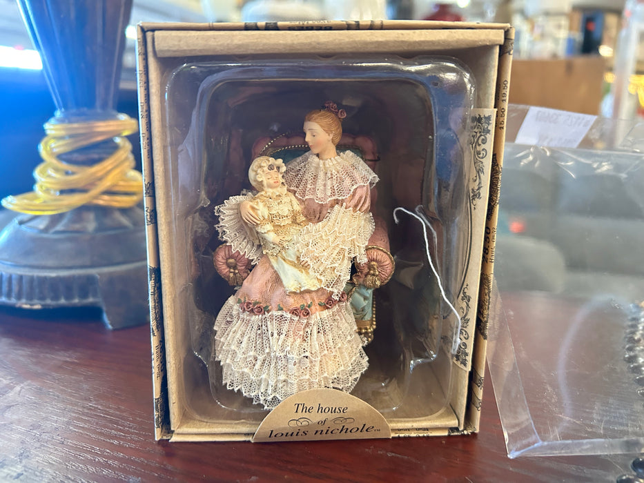 The house of Louis Nichole lady with child ornament 33607