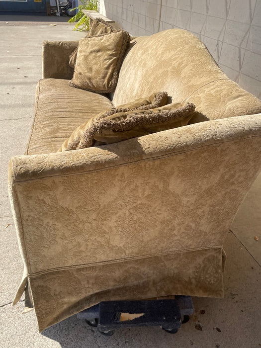 Tan/beige camelback sofa with 4 pillows 31533