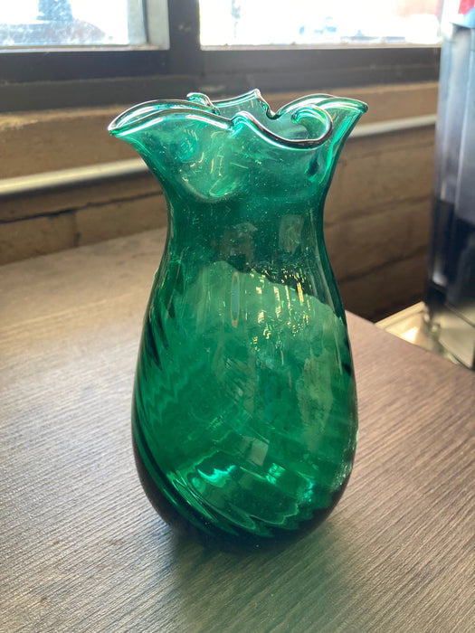 Green glass vase with curved top edges handcrafted in Mexico 25394