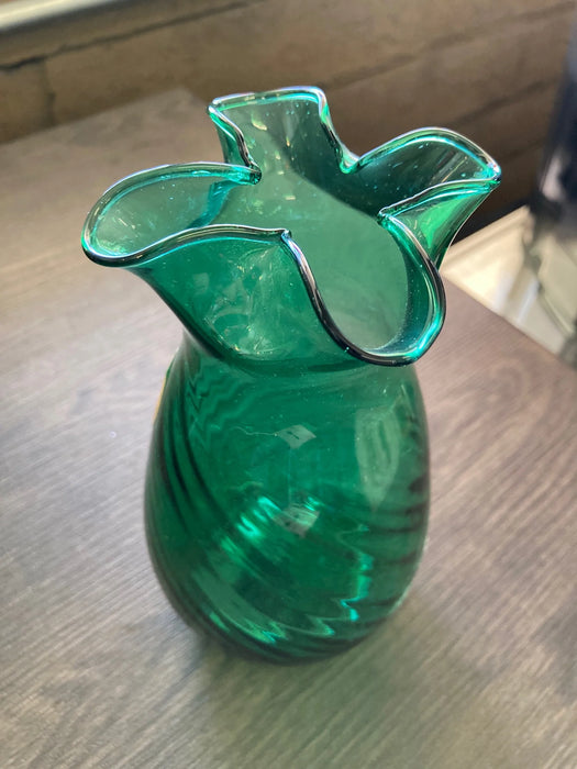 Green glass vase with curved top edges handcrafted in Mexico 25394