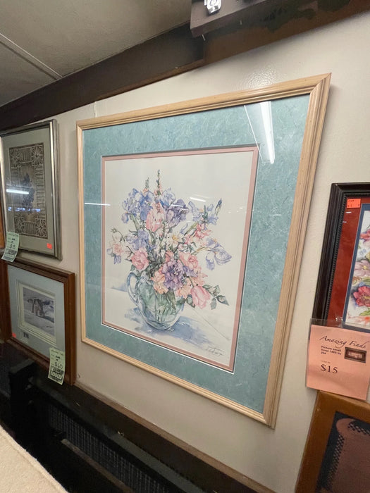Watercolor painting of bouquet of purple and pink flowers in glass jug, blue frame matted and cream colored trim 25458