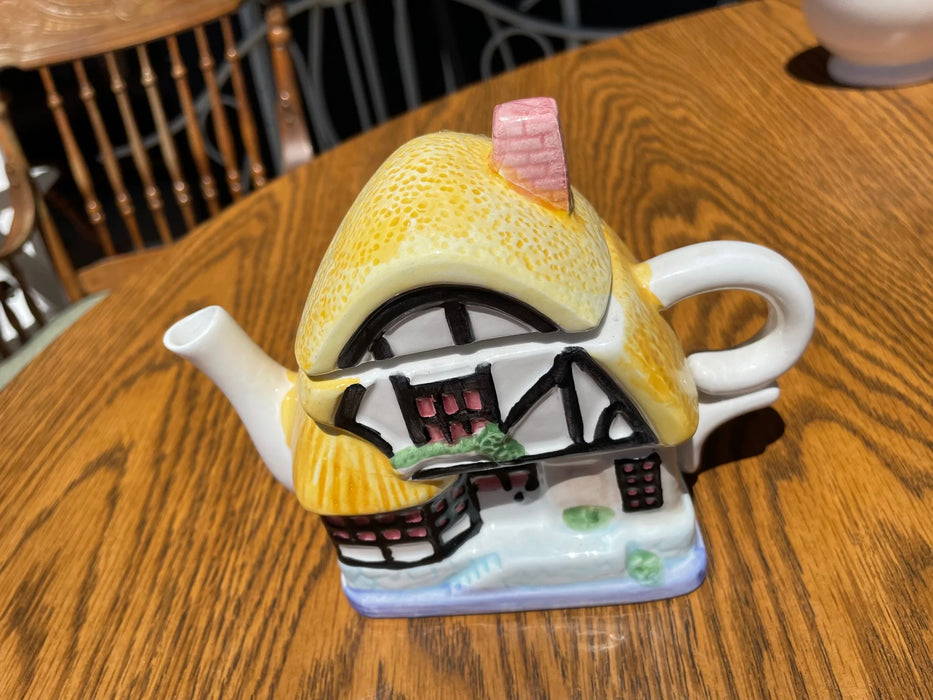 Porcelain teapot, yellow thatched roof 28998