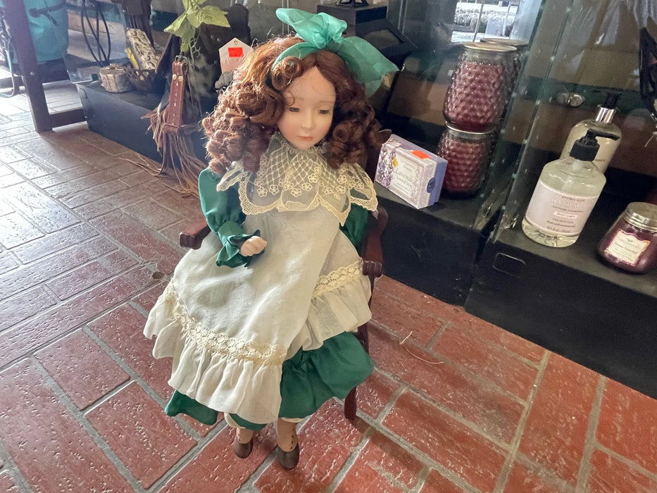 Vintage porcelain doll with green dress and chair 29769 Vintage porcelain doll with green dress and chair 29769