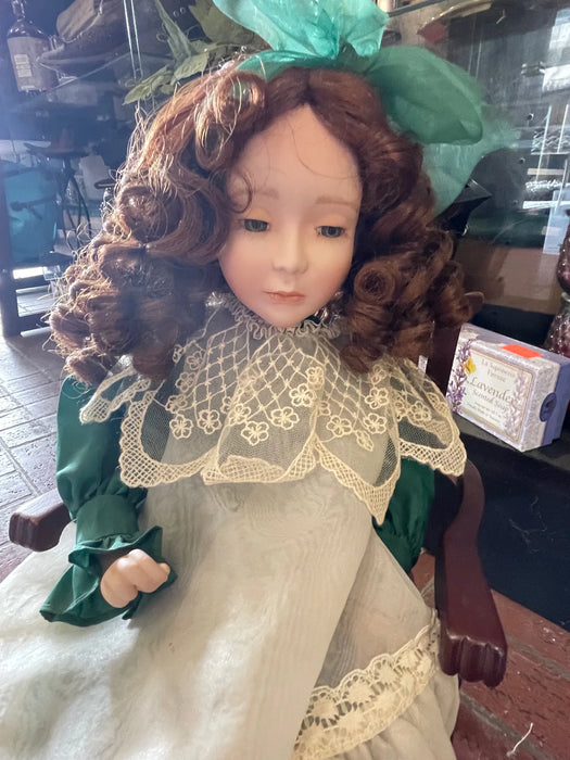 Vintage porcelain doll with green dress and chair 29769 Vintage porcelain doll with green dress and chair 29769