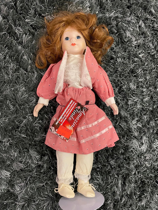 Vintage porcelain doll in pink dress 29795