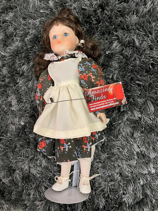 Vintage porcelain doll in floral dress 29796